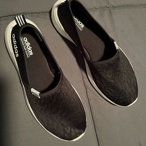 Women’s black Adidas slip ons NWOT